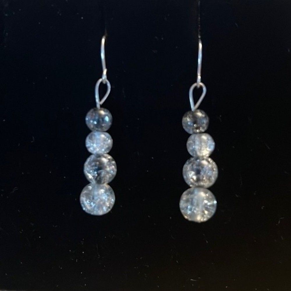 Handcrafted silver tone and glass bead earrings.